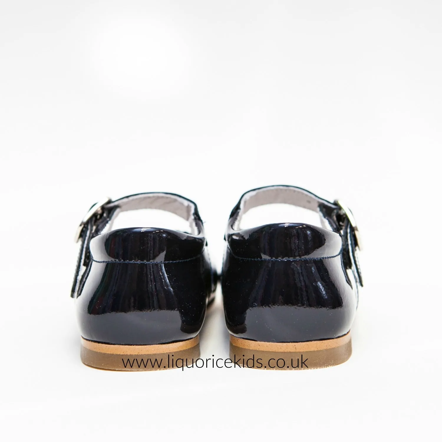 Andanines Girls Navy Blue Patent Mary Janes With Scallop Edging.