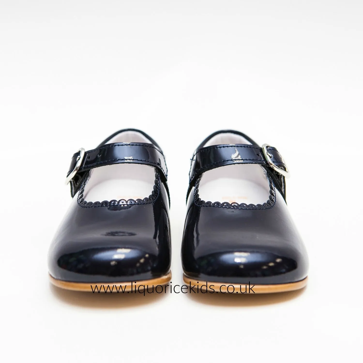 Andanines Girls Navy Blue Patent Mary Janes With Scallop Edging.